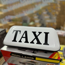 Naložite sliko v pregledovalnik galerije, Oznaka TAXI na strehi
